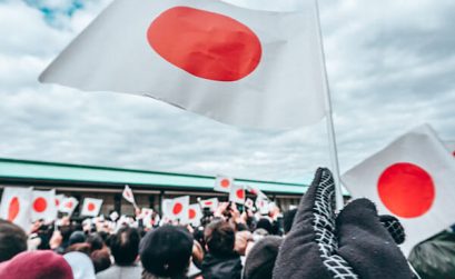 Flag waving waiting for Japanese emperor to appear